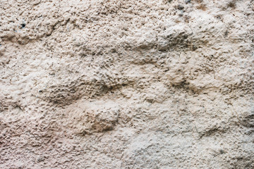 Stone background cement texture. Beige gray wall.