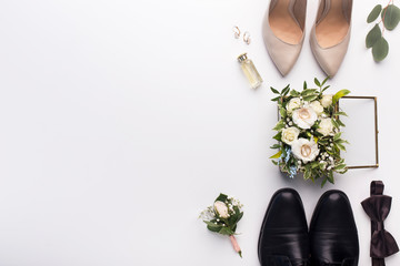 Wedding shoes and accessories on white background - obrazy, fototapety, plakaty