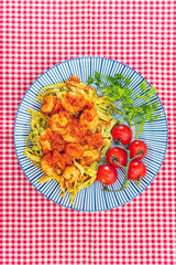 Small Gambas, stewed tomatoes, Tagliatelle with pesto