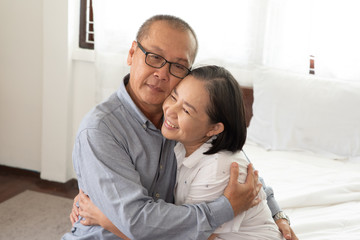 Asian senior couple at home.