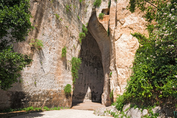 Entrance to the Orecchio di Dioniso cave, near the Greek theater of Syracuse, in Sicily Italy.