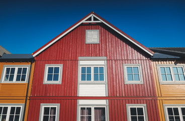 Fototapeta na wymiar facade of a traditional Rorbu red house on Lofoten islands, Scandinavian architecture details