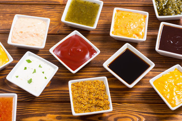 Set of different sauces in ceramic bowl