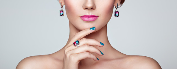 Portrait beautiful woman with jewelry. Model girl with blue manicure on nails. Beauty and...