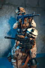 Two well equipped US army commandos armed with assault rifles. Studio shot