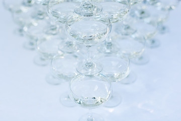 beautiful holiday table  glasses with martini wiht space for text. a set of glasses with alcohol. glasses of wine on a banquet table.