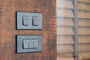 light switch on wooden Background