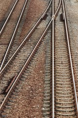 Fototapeta na wymiar old metal three railway crossing trains tracks as background