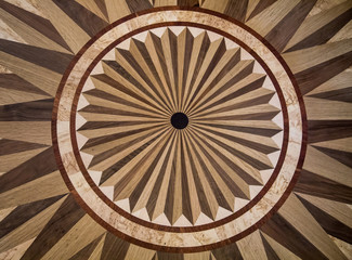 Fototapeta na wymiar Background of parquet various wood pattern with circles radiating from the center. Backgrounds Structure Design.