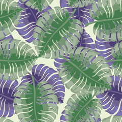Seamless pattern with tropical leaves on a green background.
