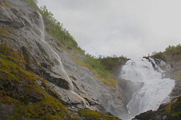 The grand waterfall of Kjosfossen in summer daytime. One of the largest in Norway