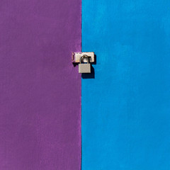 a door lock on a colorful wall, blue and purple, concept