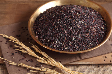 close up riceberry rice in golden tray on table, riceberry rice in kitchen background
