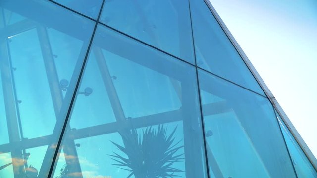 Glass Curtain Facade Wall. Fasteners Elements of Spider Glass System. Facade Detail. Architecture Abstract Background. Pan to Right