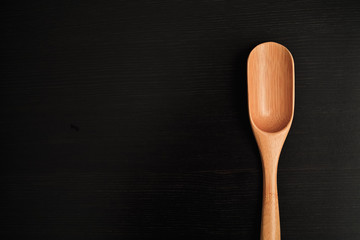 wooden spoon isolated on black background