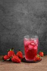 strawberry cocktail and strawberry on wooden table with a blank space for a text, Fruit in kitchen background