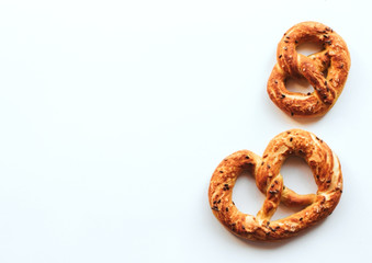  fresh golden pretzels on a white isolated background