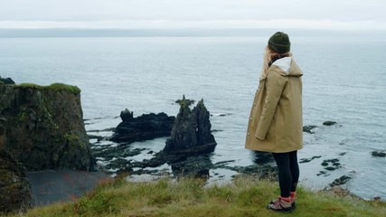 Female traveller enjoys epic landscape in iceland