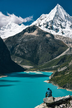 Hiker at Laguna Paron in Huscaran National Park in the Cordillera Blanca in Peru