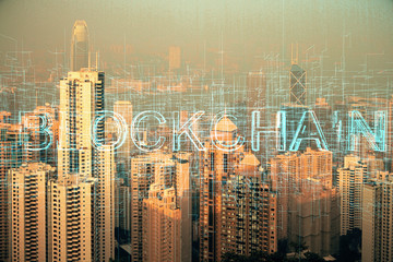 Fototapeta na wymiar Double exposure of crypto currency theme hologram drawing and city veiw background. Concept of blockchain and bitcoin.