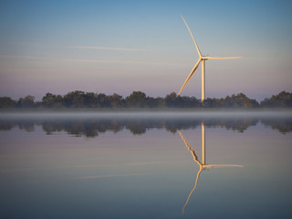 Pen-y-fan pond in Blackwood, Wales UK which has 3 wind turbines nearby