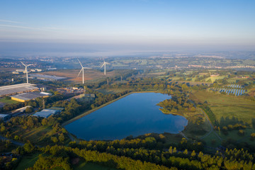 Pen-y-fan pond in Blackwood, Wales UK which has 3 wind turbines nearby