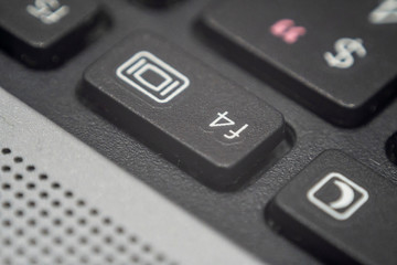 Close up of the f4 key on a keyboard