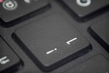 Close up of the number one and exclamation point key on a keyboard