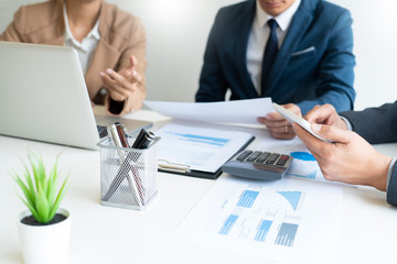 Business People Talking Discussing with coworker planning analyzing financial document data charts and graphs in Meeting and  successful teamwork Concept.