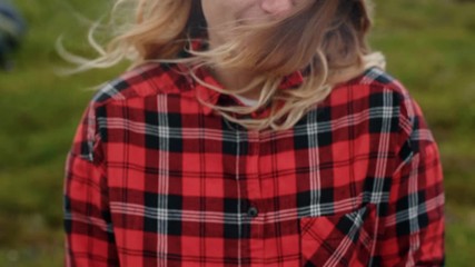 Young woman holds wild mushrooms in hands