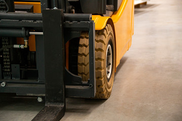 Forklift Truck. Wheels. Perspective view of Yellow Black Fork hoist . Eletric counterbalance...