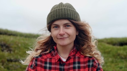 Young woman holds wild mushrooms in hands
