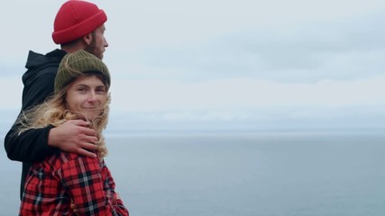 Young couple enjoys sunset at epic camping spot