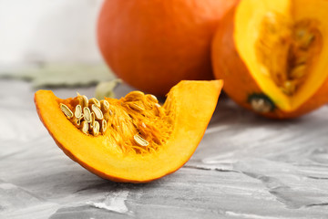 Piece of fresh pumpkin on grunge background