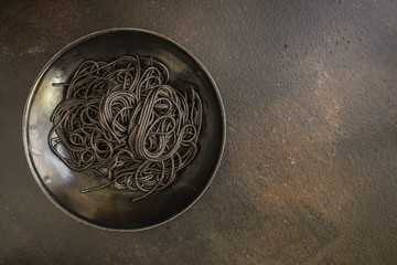 pasta black spaghetti with cuttlefish ink (main course) menu. top food background. copy space