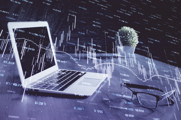 Forex market graph hologram and personal computer on background. Multi exposure. Concept of...