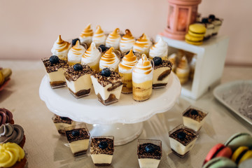 Pastel color cakes. Sweet table