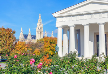 The colorful landscape of Vienna. The autumn view of Volksgarten, the Vienna City Hall and the Theseus Templee