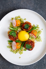 King oyster mushroom scallops, confit yolk and wasabi peas crumbs