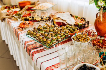 Sausage appetizers and vegetables on skewers