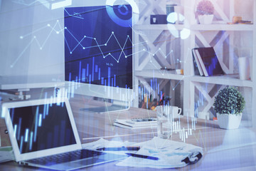 Forex market chart hologram and personal computer background. Double exposure. Concept of investment.