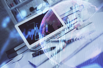 Financial graph colorful drawing and table with computer on background. Double exposure. Concept of international markets.