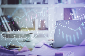 Stock market graph and table with computer background. Multi exposure. Concept of financial analysis.