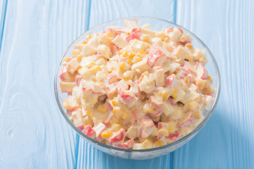 Salad with crab sticks , corn , eggs and mayonnaise