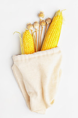 Corn in a fabric bag for products. The concept of environmental packaging for food.