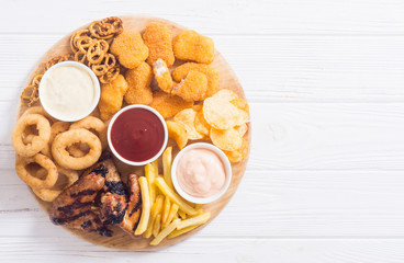 Onion rings , nuggets grilled wings , french fries and mix of snacks