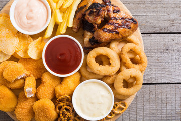 Onion rings , nuggets grilled wings , french fries and mix of snacks