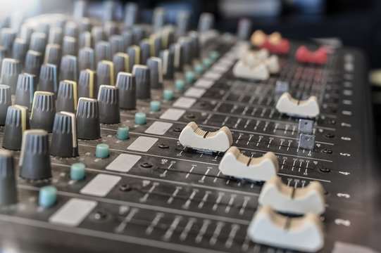 Audio sound mixer console with side view selective focus.