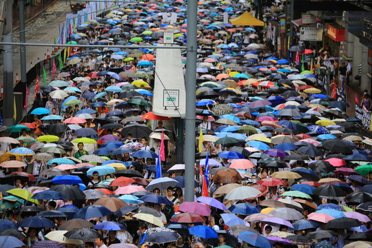 People protest on the street in hong kong on 1 July 2014
