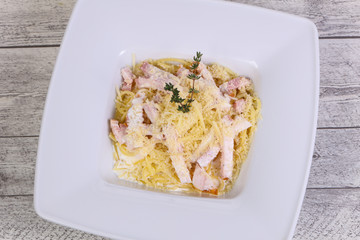 Pasta carbonara with ham and cheese